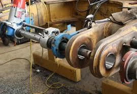 Heavy equipment component undergoing line boring